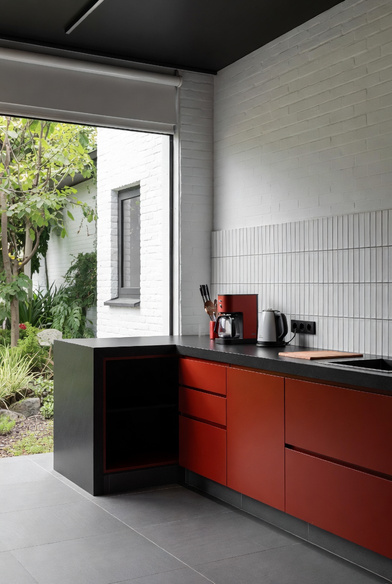Red and black outdoor kitchen — suitable for harsh climates