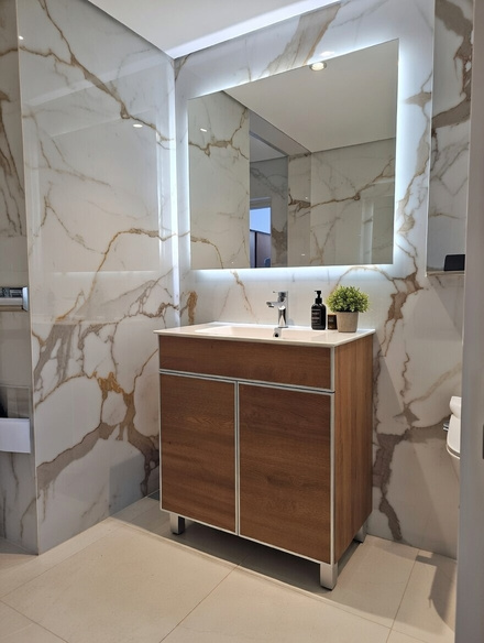 LEGACY bathroom vanity — wood front with marble wall