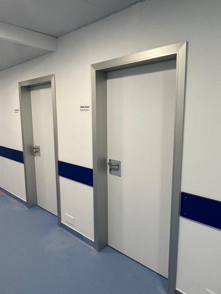 Door with telescopic frame in hospital setting