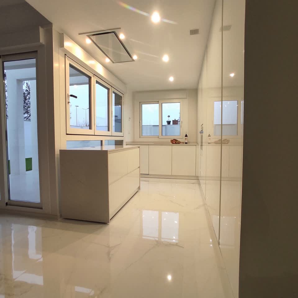 Glossy white indoor kitchen with island — ConstanKitchen client project
